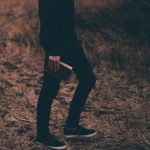 person holding book walking