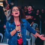 woman wearing blue button-up shirt