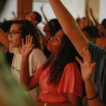 woman in orange sleeveless dress