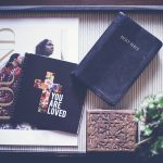 Holy Bible on black wooden tray