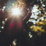persons hand with light