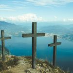 three black wooden cross during daytime