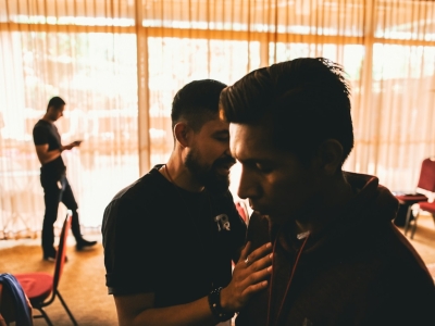 man standing beside man in room